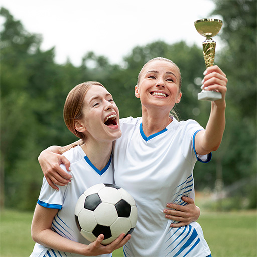Students celebrating a sports victory on the soccer field